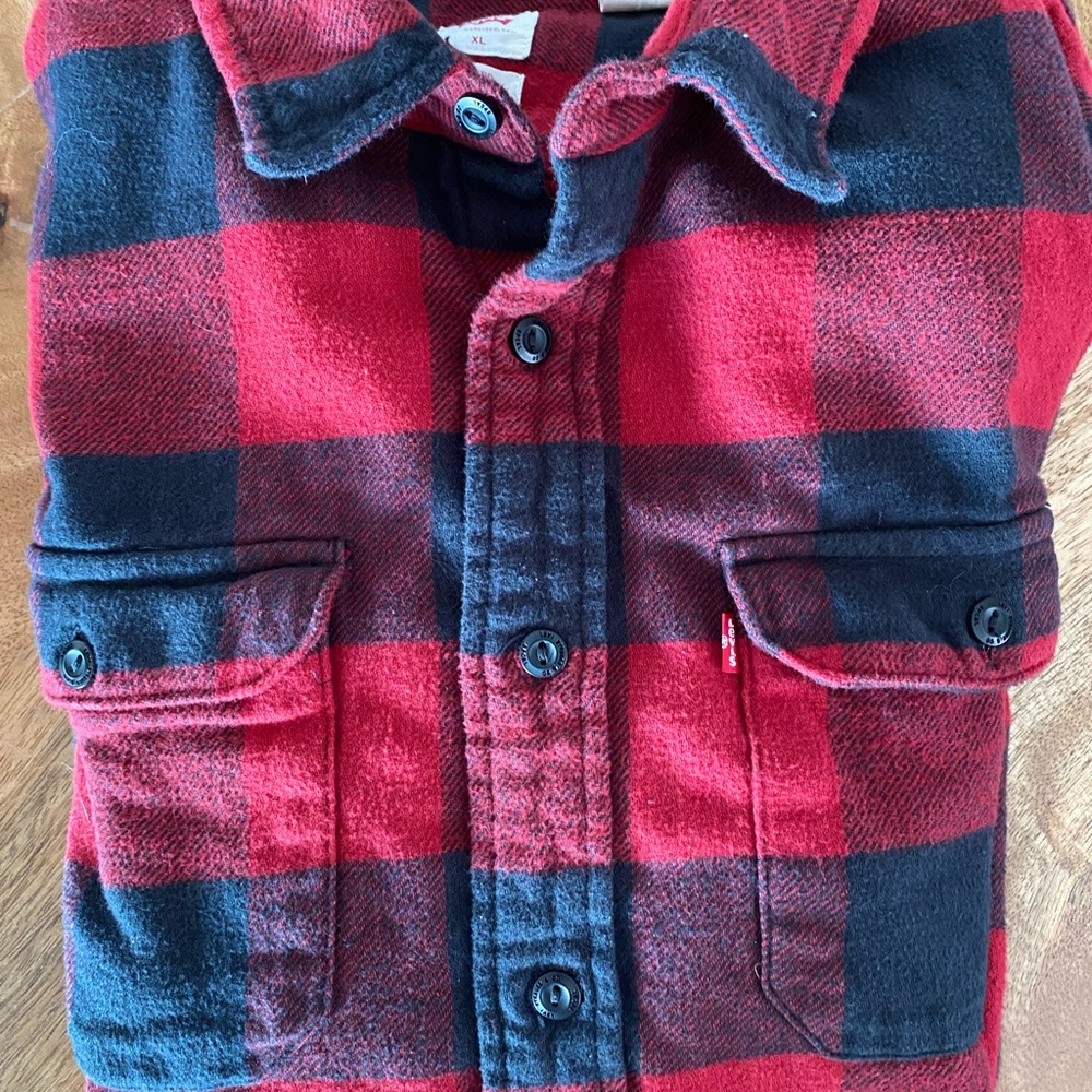 Levi’s Plaid shirt.